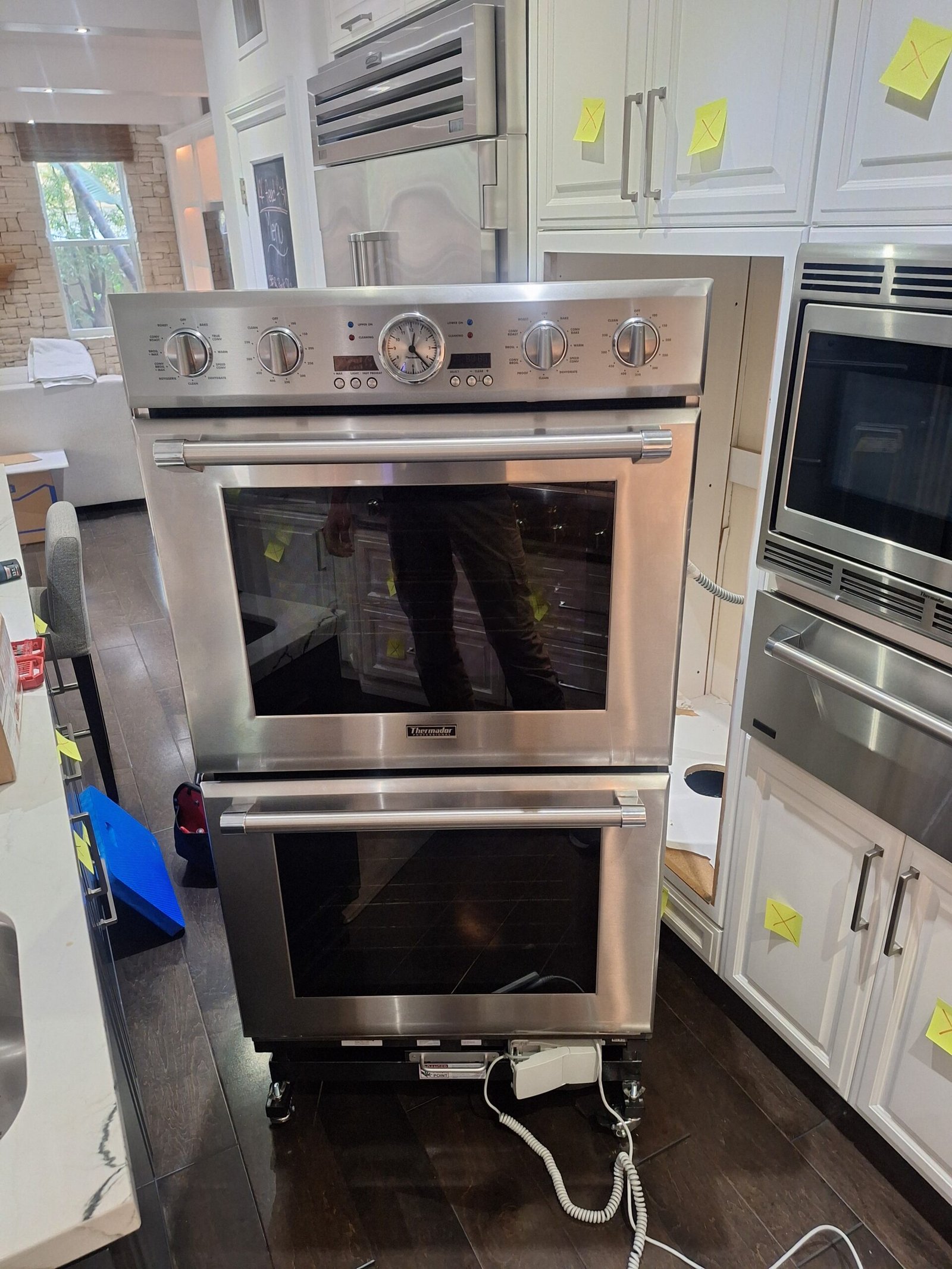 Thermador double wall oven removed from kitchen cabinetry on a service lift